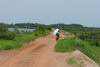 Nigeria - Rano - Kano State: on the road - bike - dirt road - photo by A.Obem