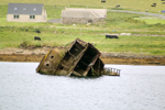 Orkney island, Mainland- The rusting hull of a block ship designed as anti submarine protectionat the 3rd Churchill Barrier - photo by Carlton McEachern