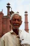 Lahore, Punjab, Pakistan: man in front of mosque - photo by G.Koelman