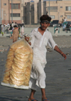 Karachi, Sindh, Pakistan: man selling waffers on the beach - photo by R.Zafar