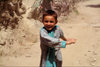 Pakistan - Karimabad - Northern Areas province: little girl running - photo by A.Summers
