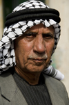 Hebron, West Bank, Palestine: portrait of local man wearing a keffiyeh scarf - photo by J.Pemberton