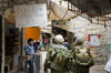 Hebron, West Bank, Palestine: Israeli soldiers walking past a Palestinian caf - Freedom coffee shop - Tzahal -  Israel Defense Forces - IDF - photo by J.Pemberton