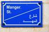 Bethlehem, West Bank, Palestine: Manger street - sign in English and Arabic - odonym - photo by M.Torres