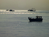 Panama City: fishing boats silhouetted against the morning sky - photo by H.Olarte