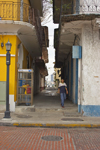 Panama City: one of the multiple alleys that crisscross the Old Quarter - in the background the modern city skyline through the haze - Casco Viejo, the Old Quarter, is the second city, built after Panama la Vieja was burnt to prevent Sir Henry Morgan from looting it - photo by H.Olarte