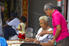 Panama City: an old woman sells lottery tickets at La Bajada de Salsipuedes - photo by H.Olarte