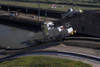 Panama Canal: Miraflores locks - locomotives used to tow ships along the locks - jump - photo by H.Olarte