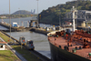 Panama Canal: Miraflores locks - locomotives towing a Panamax vessel - photo by H.Olarte