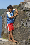 Local kid poses for the camera at Fuerte de San Jeronimo, Portobello, Coln, Panama, Central America - photo by H.Olarte
