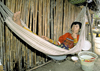 Panama - comarca Kuna Yala - San Blas Islands: Kuna woman in an hammock - photo by A.Walkinshaw