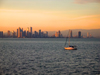 Panama City: seen from the Pacific Ocean - sailboat with skyline as background - photo by H.Olarte