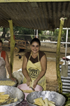La Villa, Azuero, Los Santos province, Panama: woman smiles at the camera while peeling corn cobs at El Ciruelo folk food place - photo by H.Olarte