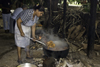La Villa, Azuero, Los Santos province, Panama: cooking over an open fire and picking chicken with a huge spoon at El Ciruelo folk food place, - photo by H.Olarte