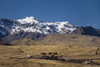 Puno region, Peru: hills with snow - the Andes and the high Altiplano as seen from the train from Puno to Cusco - photo by C.Lovell