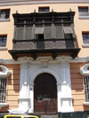 Trujillo, La Libertad region, Peru: solemn facade of an old colonial manor  wooden balcony  Moorish oriel window - photo by D.Smith