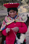 Cuzco region, Peru: young Quechua woman spinning wool - Peruvian Andes - photo by C.Lovell