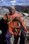 Cuzco region, Peru: old Quechua man playing guitar - Peruvian Andes - photo by C.Lovell