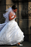 Lima, Peru: a bride rushes to her wedding - Archbishop's palace in the background - Plaza de Armas - photo by M.Torres