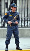 Lima, Peru: policeman with AK-47 Kalshnikov rifle guards the Government Palace - Plaza de Armas - photo by M.Torres