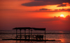 Philippines - Beach - sunset - resort benches on the water - photo by B.Henry