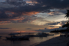 Alona Beach, Bohol island, Central Visayas, Philippines: boats on the beach with storm clouds at sunset - photo by S.Egeberg