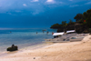 Alona Beach, Bohol island, Central Visayas, Philippines: bancas and toursits on the beach - storm clouds - photo by S.Egeberg
