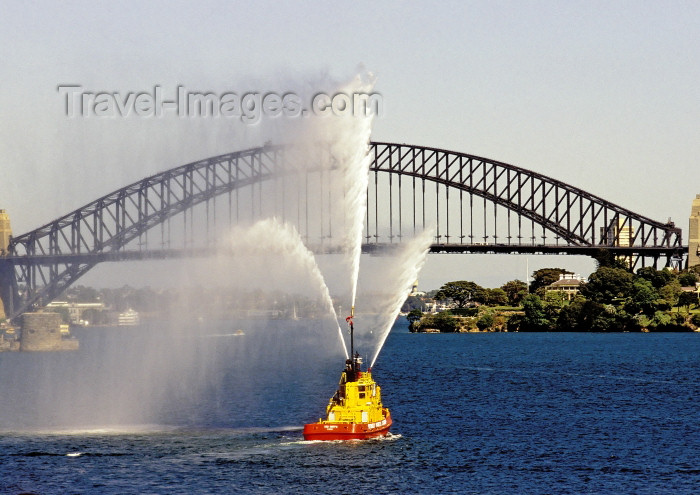 australia443: Australia - Sydney (NSW): tug boat show and Harbour Bridge - water jets (photo by A.Walkinshaw) - (c) Travel-Images.com - Stock Photography agency - Image Bank