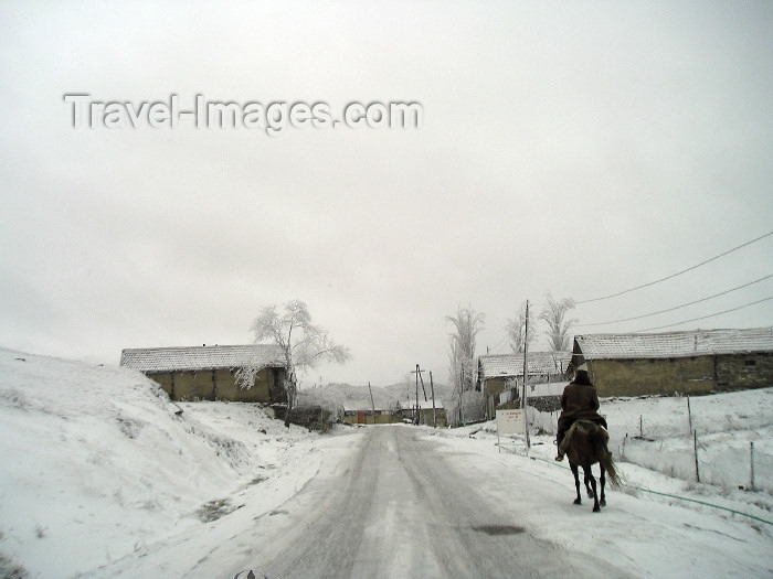 azer256: Azerbaijan - Alti Agac / Altyagach / Altyagac / Altiagach / Altiaghaj (Xizi rayon - NE Azerbaijan): on the way to Cennet Bagi Paradise Resort - winter - snow - road - horseman (photo by F.MacLachlan) - (c) Travel-Images.com - Stock Photography agency - Image Bank