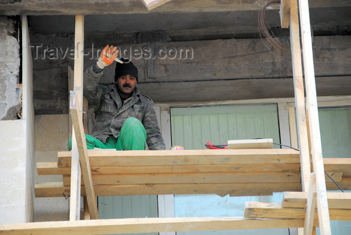 azer379: Azerbaijan - Baku: old town - friendly builder on a shaky scaffold - construction worker - construction site - photo by M.Torres - (c) Travel-Images.com - Stock Photography agency - Image Bank