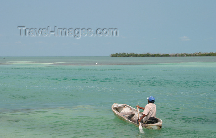 belize43: Belize - Caye Caulker - Ambergris Caye: me, my God, my dreams - canoe - lonely fisherman on the caribean sea - Caribbean Sea - photo by C.Palacio - (c) Travel-Images.com - Stock Photography agency - Image Bank