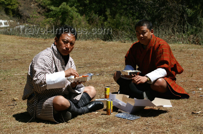 bhutan156: Bhutan - Haa valley - Lunch time - wearing a gho - photo by A.Ferrari - (c) Travel-Images.com - Stock Photography agency - Image Bank