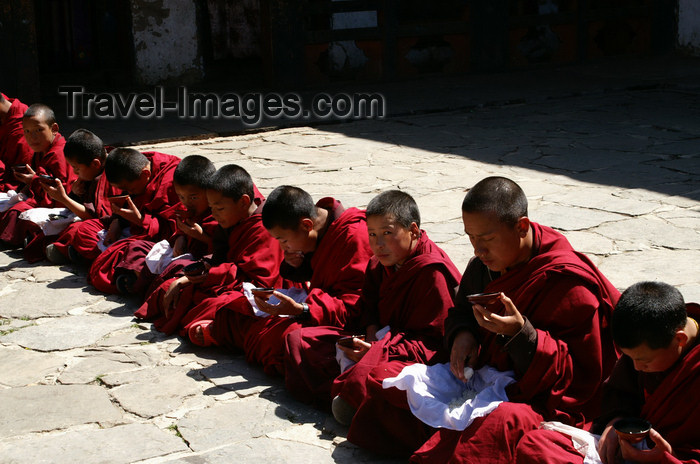 bhutan161: Bhutan - line of monks having lunch, in Haa Trasang - photo by A.Ferrari - (c) Travel-Images.com - Stock Photography agency - Image Bank
