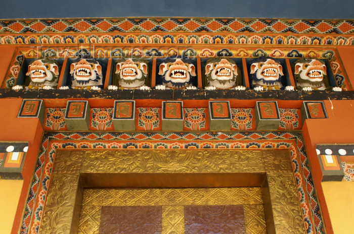 bhutan290: Bhutan - Scary faces carved in wood, in Khansum Yuelley Namgyal Chorten - gate - photo by A.Ferrari - (c) Travel-Images.com - Stock Photography agency - Image Bank