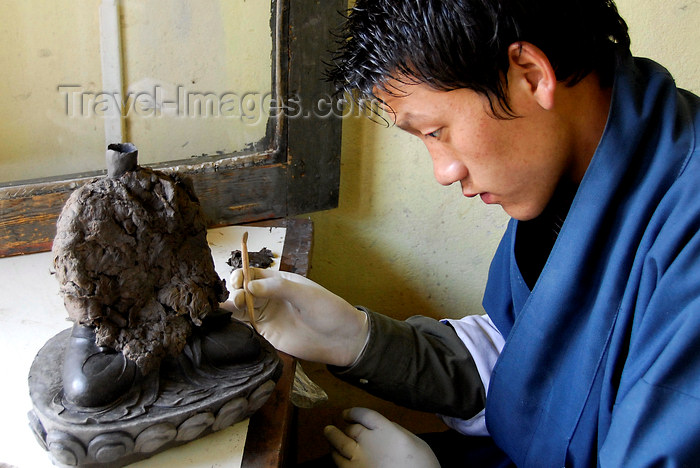 bhutan431: Bhutan, Thimpu, Student crafting statue at National Technical Training Institute - photo by J.Pemberton - (c) Travel-Images.com - Stock Photography agency - Image Bank