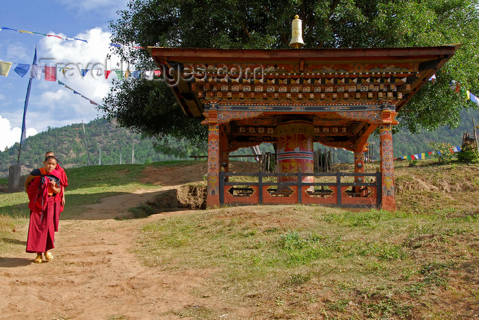 bhutan434: Bhutan, Punakha, Monks and large outdoor prayer wheel - photo by J.Pemberton - (c) Travel-Images.com - Stock Photography agency - Image Bank