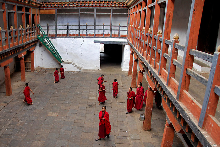 bhutan436: Bhutan, Punakha, Monks in courtyard of Wangdue Phodrang Dzong - photo by J.Pemberton - (c) Travel-Images.com - Stock Photography agency - Image Bank