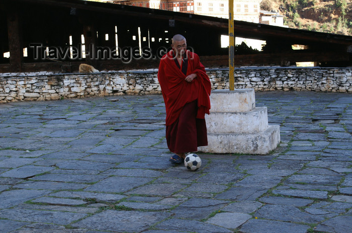 bhutan71: Bhutan - Paro: monk playing football - outside the Paro Dzong - photo by A.Ferrari - (c) Travel-Images.com - Stock Photography agency - Image Bank