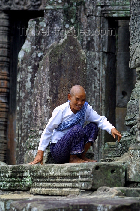 cambodia102: Angkor, Cambodia / Cambodge: Bayon temple - an ascetic monk burns incense - photo by R.Eime - (c) Travel-Images.com - Stock Photography agency - Image Bank