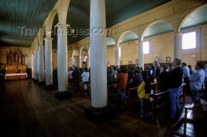 chile202: Dalcahue, Chiloé island, Los Lagos Region, Chile: interior with worshipers of the neoclassical 19th century church - Doric columns - Patrimonio de la Humanidad - photo by C.Lovell - (c) Travel-Images.com - Stock Photography agency - Image Bank