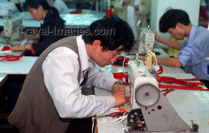 china248: Dongguan, Guangdong province, China: seamster using a sewing machine - Chinese factory worker - photo by B.Henry - (c) Travel-Images.com - Stock Photography agency - Image Bank