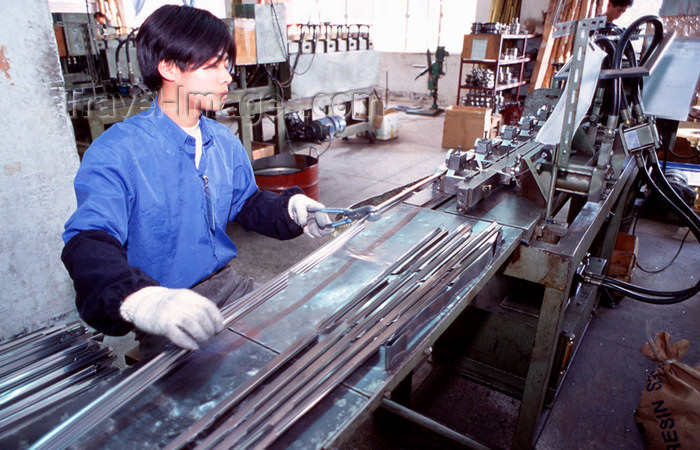 china254: Dongguan, Guangdong province, China: metal worker - Chinese factory - photo by B.Henry - (c) Travel-Images.com - Stock Photography agency - Image Bank