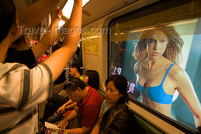 china271: Shanghai, China: subway riders - ad girl at the window - photo by Y.Xu - (c) Travel-Images.com - Stock Photography agency - Image Bank