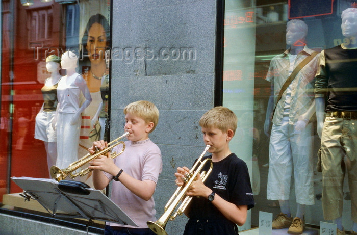 denmark15: Copenhagen, Denmark: two boys playing trumpets on the street - music stand with sheet music - clothes shop windows - photo by K.Gapys - (c) Travel-Images.com - Stock Photography agency - Image Bank