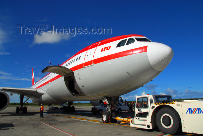 dominican189: Punta Cana, Dominican Republic: LTU Airbus A330-322 D-AERQ and Aircraft Tow Tractor with Towbar - Punta Cana International Airport - PUJ / MDPC - photo by M.Torres - (c) Travel-Images.com - Stock Photography agency - Image Bank