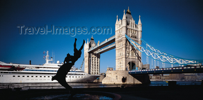 england769: London, England: Tower Bridge open for MV Seabourn Pride 5-star cruise ship and 'Girl with a Dolphin' sculpture by David Wynne - photo by A.Bartel - (c) Travel-Images.com - Stock Photography agency - Image Bank