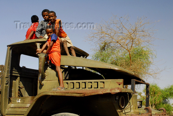 eritrea43: Eritrea - Keren, Anseba region: boys playing on a rusting Soviet truck - photo by E.Petitalot - (c) Travel-Images.com - Stock Photography agency - Image Bank