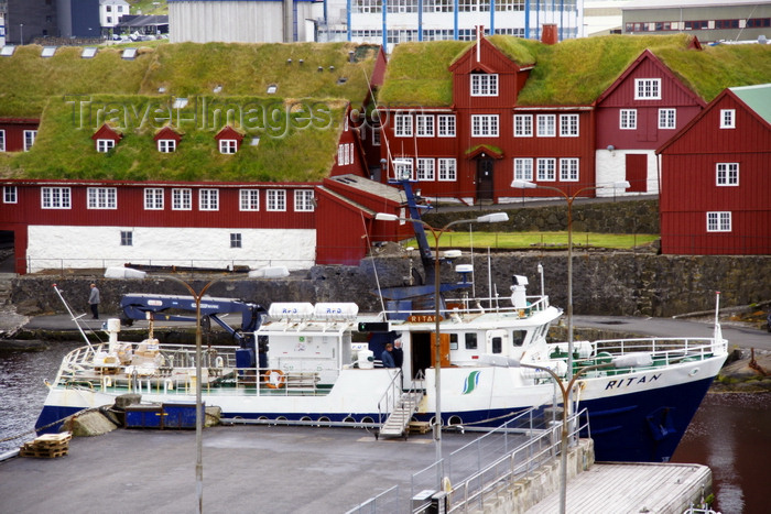 faeroe119: Tórshavn, Streymoy island, Faroes: ferry M/F Ritan in the east harbour ready to go to Nólsoy - government buildings in Tinganes in the background - red buildings with green sod roofs - photo by A.Ferrari - (c) Travel-Images.com - Stock Photography agency - Image Bank