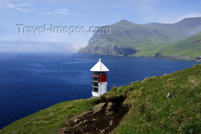 faeroe77: Sørvágsfjørður fjord, Vágar island, Faroes: lighthouse perched over the sea - solar power operated - photo by A.Ferrari - (c) Travel-Images.com - Stock Photography agency - Image Bank