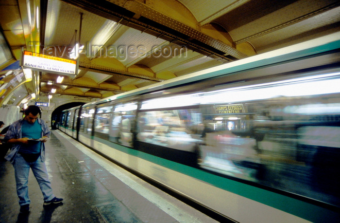 france999: Paris, France: man on metro platform - blurred train in motion, Champs-Élysées–Clemenceau station - 8e arrondissement - photo by K.Gapys - (c) Travel-Images.com - Stock Photography agency - Image Bank